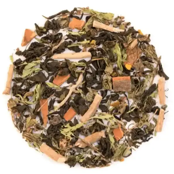 A round heap of loose tea blend seen from above, dark tea leaves mixed with pale root sticks, cinnamon chips and green herb leaves